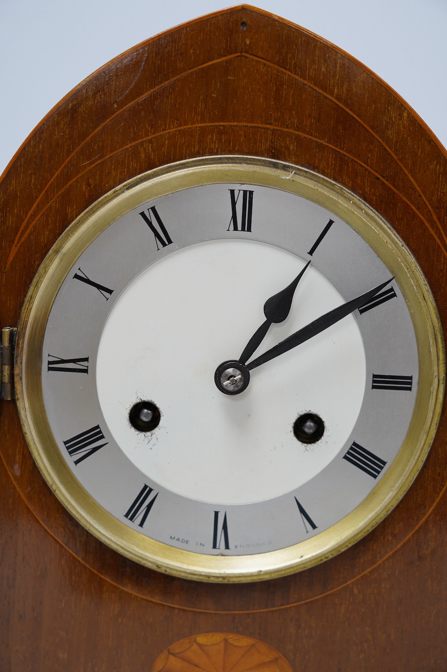 An Edwardian inlaid mahogany eight day lancet topped mantel clock, with key, 31cm high. Condition - fair, untested